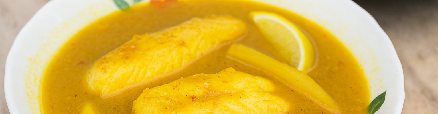 Hot and sour Thai fish curry with chunks of firm white fish in a golden spiced broth.